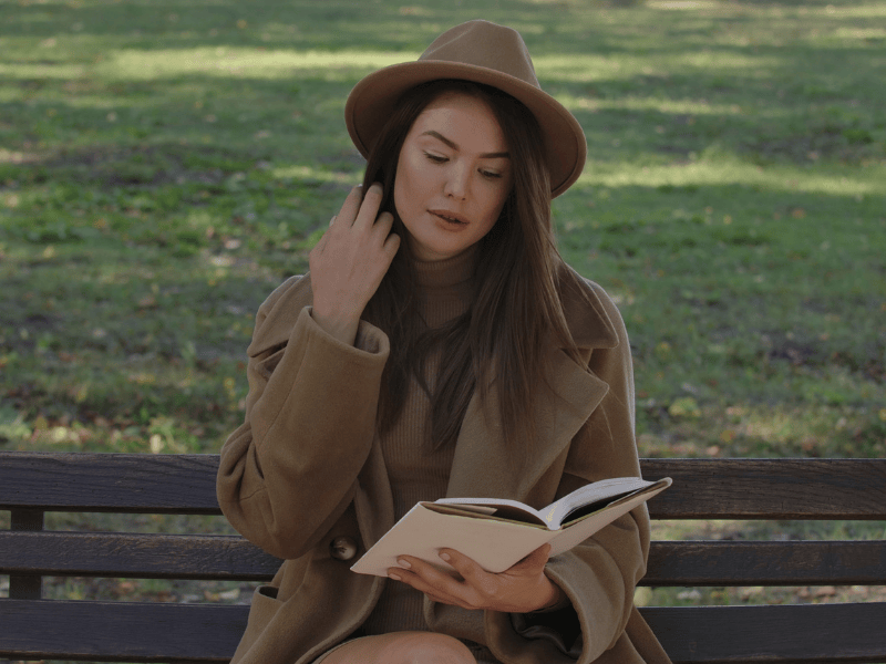 A Gen Z man quietly reflecting by the river, thinking about money and values